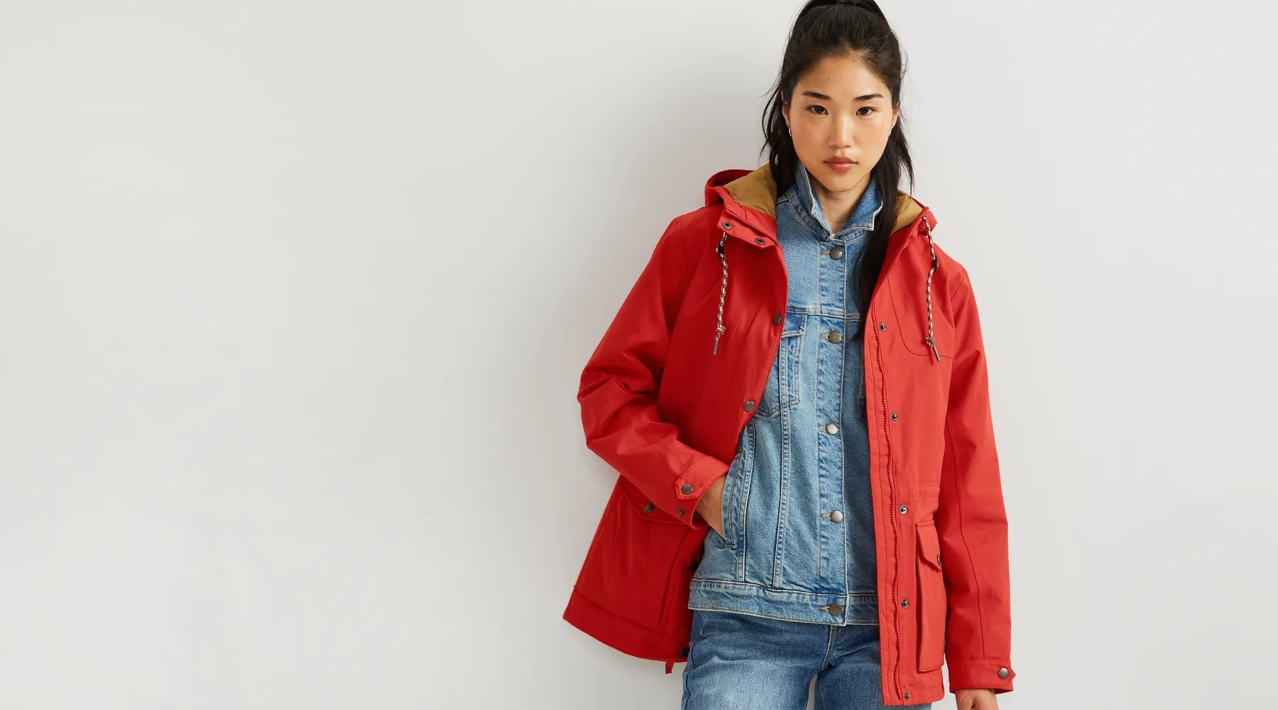 A women wearing a Charly Waterproof Jacket over a denim jacket.
